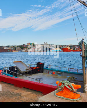 Fishing trawler and view of port, St John's Newfoundland, Canada Stock Photo