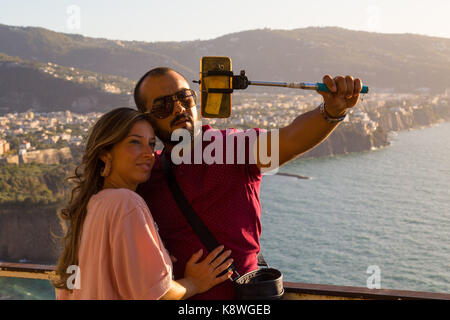Sorrento, Italy, September 17 2017. A couple take pictures with a smartphone overlooking Sorrento, Italy. © Paul Davey Stock Photo