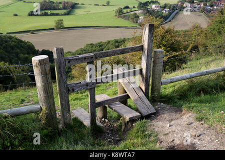 A stile at Devil's Dyke on the south Downs, over looking the village of Poynings, West Sussex United Kingdom Stock Photo