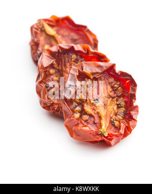 Tasty dried tomatoes isolated on white background. Stock Photo
