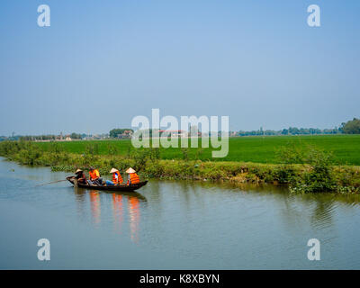 Hue, Vietnam - September 13 2017: Unidentified people in a boat paddling and enjoying the view in the river located in Hue in Vietnam Stock Photo