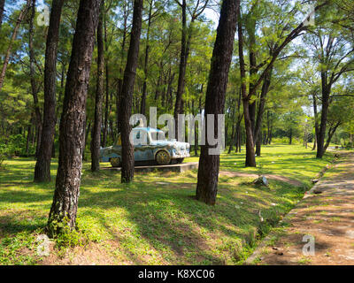 Hue, Vietnam - September 13 2017: Beautiful stoned car inside of a forest in a public park located near of Hue town in Vietnam Stock Photo