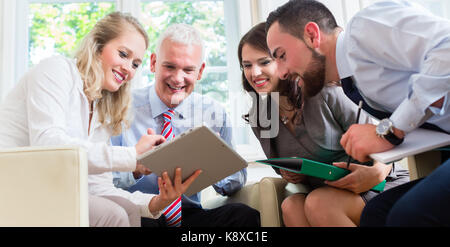 Businesspeople having discussion in office Stock Photo