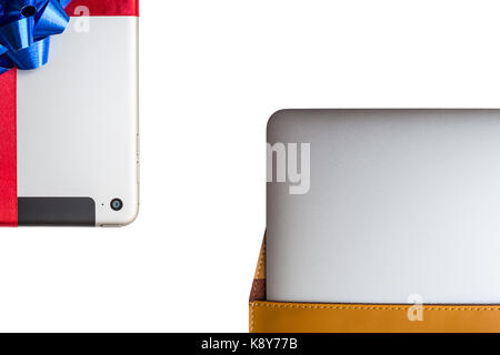 Tablet for gift and Portable computer in a leather cover case on white background Stock Photo