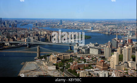 Aerial view of New York City with East River and Brooklyn, Manhattan, Williamsburg and Queensboro bridges visible. Stock Photo