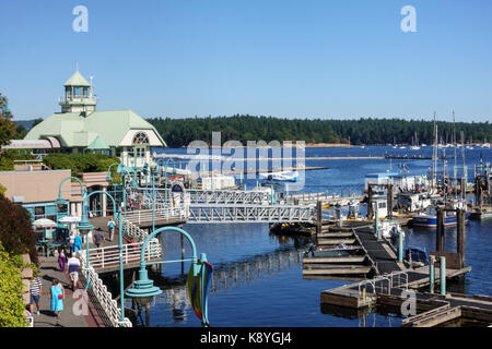 Public walkway and floating docks at Nanaimo boat basin waterfront, Vancouver Island, British Columbia, Canada Stock Photo