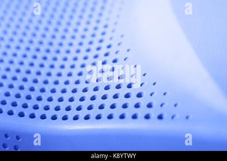 Abstract light colored surface with holes built in a row for creativity, wallpapers and backgrounds. Stock Photo