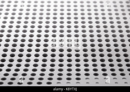 Abstract light colored surface with holes built in a row for creativity, wallpapers and backgrounds. Stock Photo