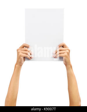 Hands holding A4 size white blank paper card board, isolated on plain background. Stock Photo