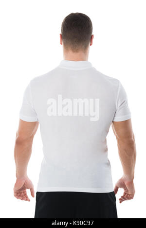 Rear view of man in casuals standing against white background Stock Photo