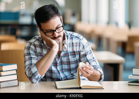 Portrait of young male student in library Stock Photo