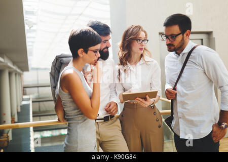Group of young perspective businesspeople having discussion Stock Photo