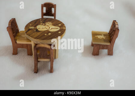 Wooden Miniature table and chairs in a white background Stock Photo