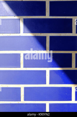 glazed brick wall with shadow Stock Photo