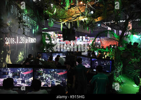 Tokyo, Japan. 21st Sep, 2017. Visitors are seen playing games during the Tokyo Game Show 2017 in Chiba, Japan, Sept. 21, 2017. Tokyo Game Show 2017 opened on Thursday with 609 companies and organizations from 36 countries and regions exhibiting at the game show. Credit: Ma Ping/Xinhua/Alamy Live News Stock Photo