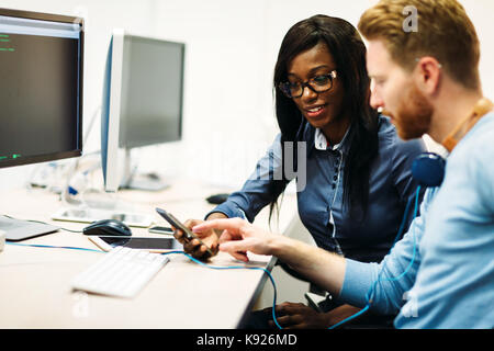Software engineers working on project and programming in company Stock Photo