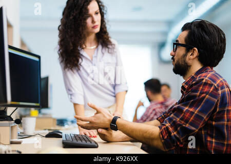 Software engineers working on project and programming in company Stock Photo