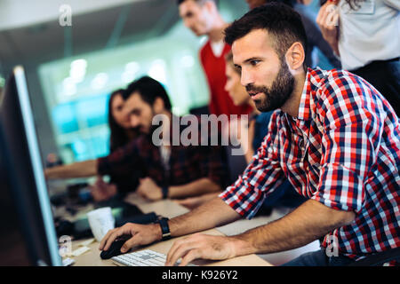 Portrait of programmers working in development software company Stock Photo