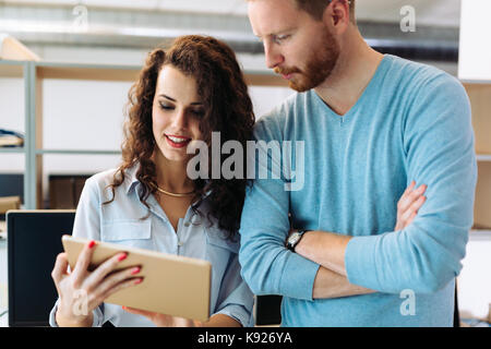 Portrait of software engineers using digital tablet Stock Photo