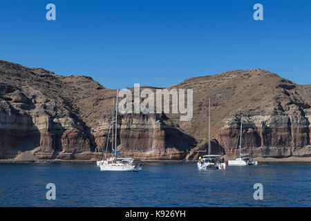 Bay of santorini with catamaran in the water Stock Photo