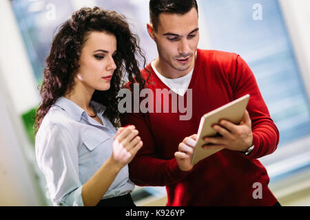 Portrait of software engineers using digital tablet Stock Photo