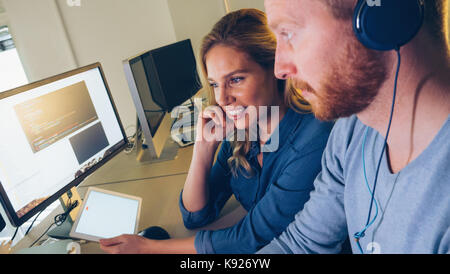 Software engineers working on project and programming in company Stock Photo
