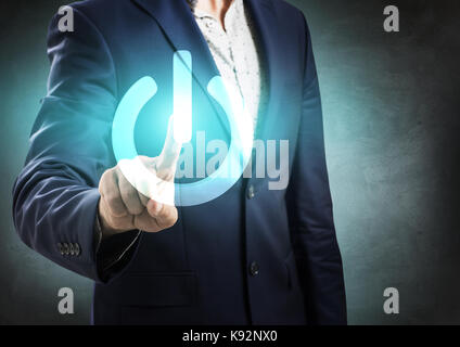 Businessman pressing power futuristic button. Stock Photo
