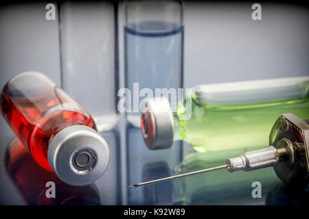 Diagnosis - Treatment and prevention. Medical Report with Composition of Medicaments - Vials, Injections and Syringe. Selective Focus Stock Photo