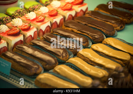 Eclair cakes in a patisserie in Falaise,Calvados, Normandy, France. Aug 2017