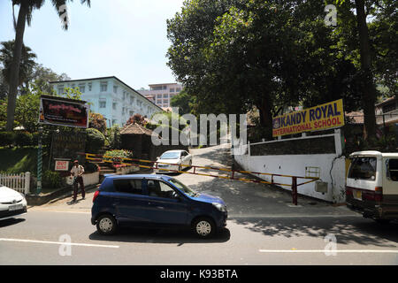 Kandy Sri Lanka Traffic outside the exit of Hotel Suisse and Kandy Royal International School (KRIS) Stock Photo