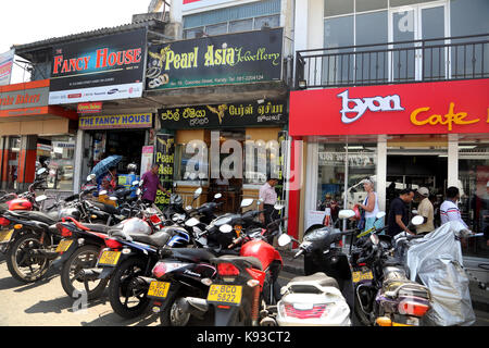 Kandy City Colombo Street Sri Lanka Motorcycles outside Cafe and shops Stock Photo