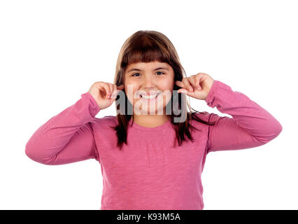 Pretty girl with pink t-shirt covering her ears isolated on a white background Stock Photo