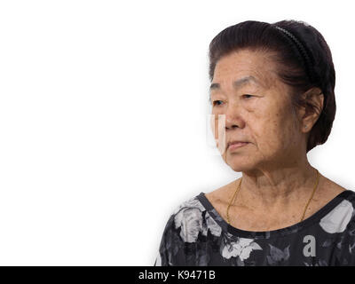 elderly asian woman looking sad and lonely. elderly man has lost her memory caused by Alzheimer's disease and Major depressive disorder (depression) Stock Photo