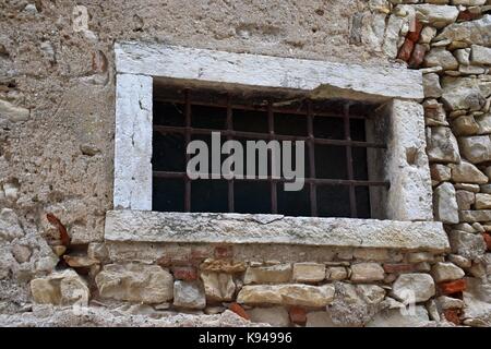 hirstorical and antique old fenced window in italy, lake garda Stock Photo