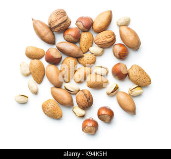 Different types of nuts in the nutshell. Hazelnuts, walnuts, almonds, pecan nuts and pistachio nuts isolated on white background. Stock Photo