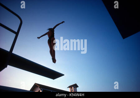 A young diver practicing off the one meter board in Ft. Lauderdale, Florida Stock Photo