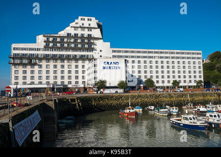 The Grand Burstin Hotel in Folkstone, Kent, UK. Part of the Britannia hotel group and view of the harbour Stock Photo