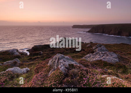 Sunset over Pendower Cove near Lands End Cornwall Stock Photo