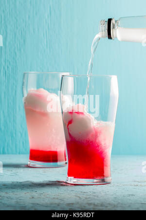 Preparation of cocktail Terremoto. Chilean traditional alcoholic drink Terrremoto. with pineapple ice cream, liquor grenadine, pisco and white wine. B Stock Photo