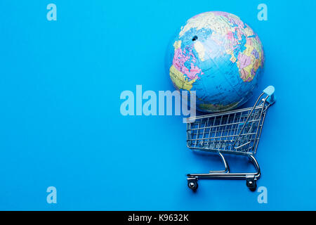 Shopping cart on a blue background Stock Photo