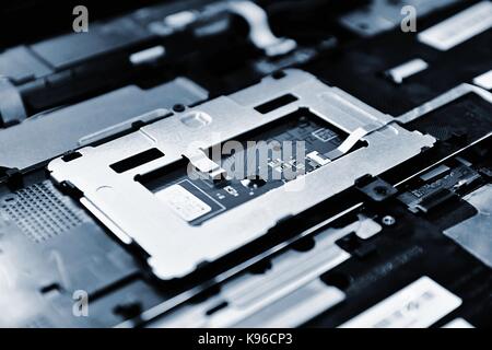 Closeup of the chip of the old notebook computer motherboard. Stock Photo