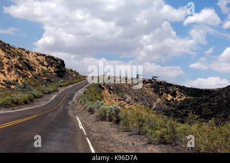 Road curves around the Petroglyph National Monument in Albuquerque, New Mexico. Stock Photo