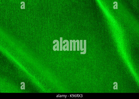 Green silk velvet close up with copy space. Background and texture Stock Photo