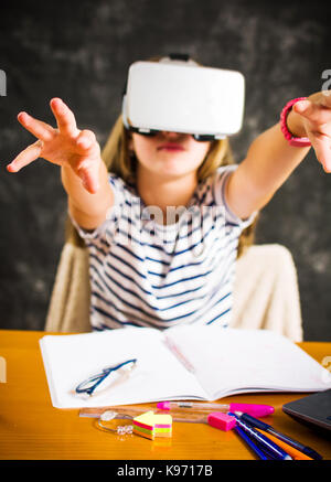 Teenage girl having fun with virtual reality glasses Stock Photo