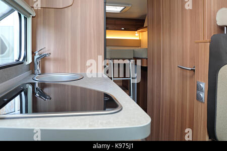 Kitchen Counter and Bedroom in Camping Van Stock Photo
