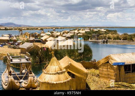 The Uros islands, reed houses and reed based islands in Lake Titikaka, Andes Highlands, Peru Stock Photo