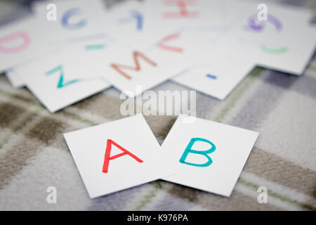 English; Learning the New Word with the Alphabet Cards Stock Photo