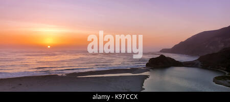 Sunset over Little Sur River mouth. Stock Photo