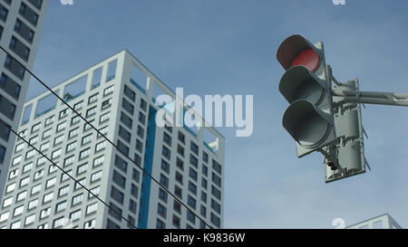 Traffic light changes from red to greent In The City. Traffic light In The City Stock Photo
