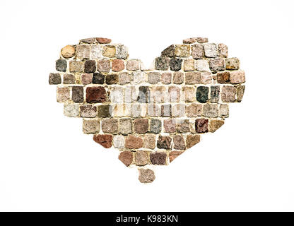 Heart shape made of medieval wall preserved stone blocks from a stone wall isolated on a white background Stock Photo
